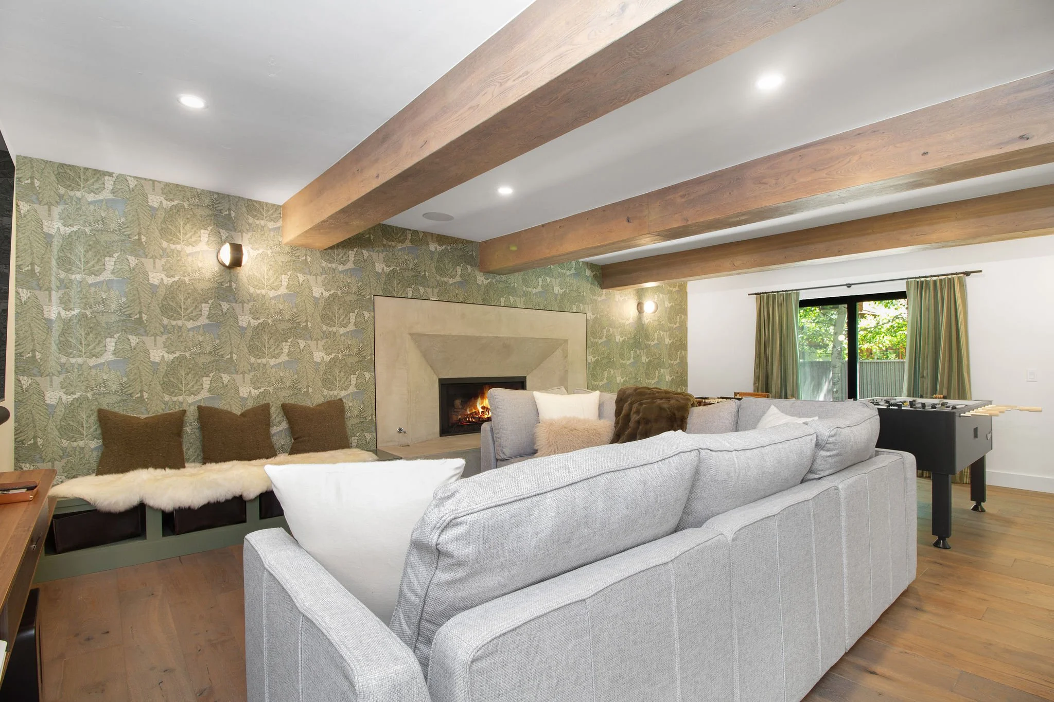 Throughout the renovation, every room was updated to meet the expectations of modern luxury living. New flooring, lighting, windows, doors, and custom built-ins bring consistency and warmth to the interiors while framing the home's spectacular Warm S
