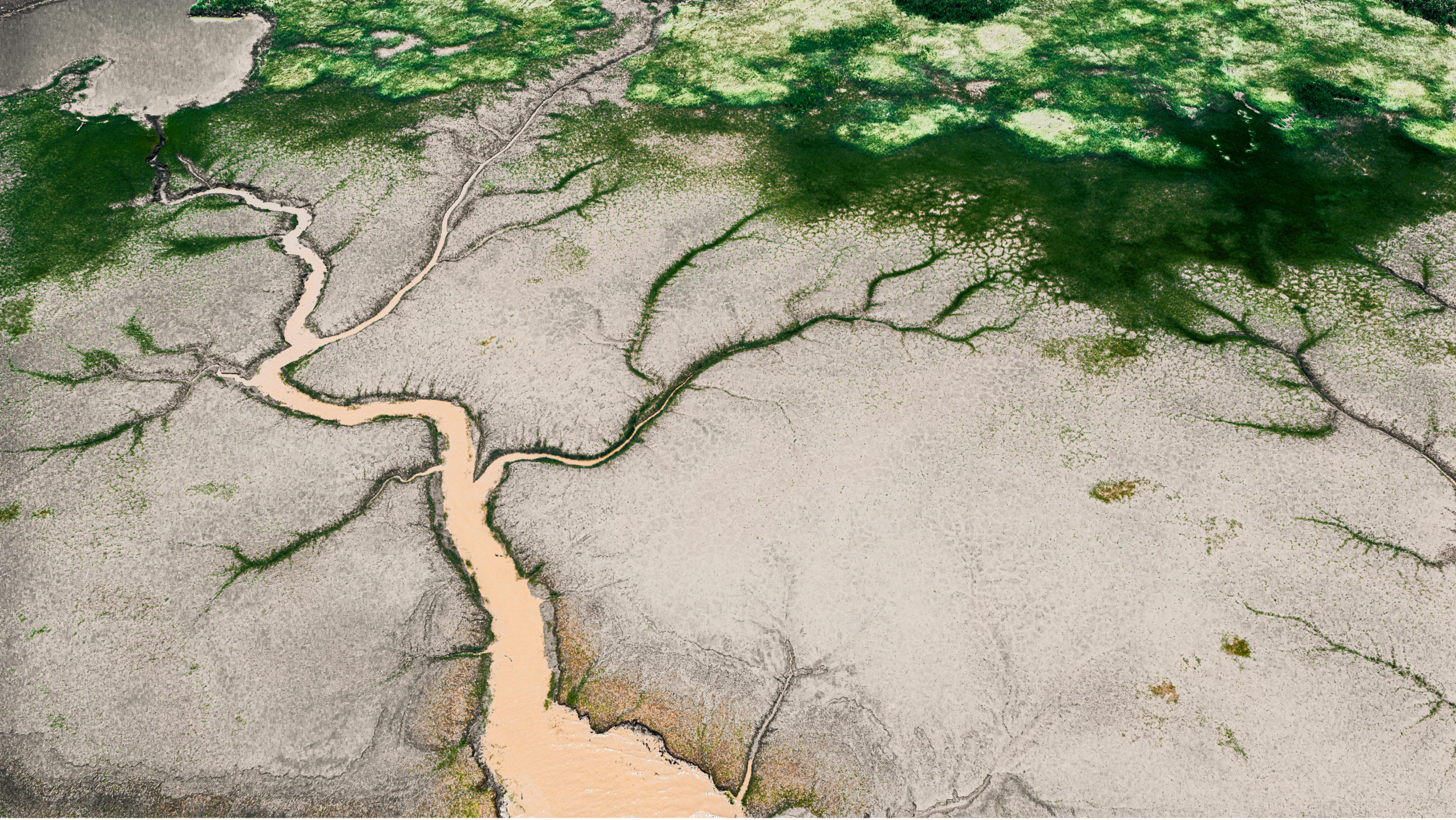 Aerial view of a drying river system illustrating water scarcity, climate stress, and the growing pressure on water infrastructure.