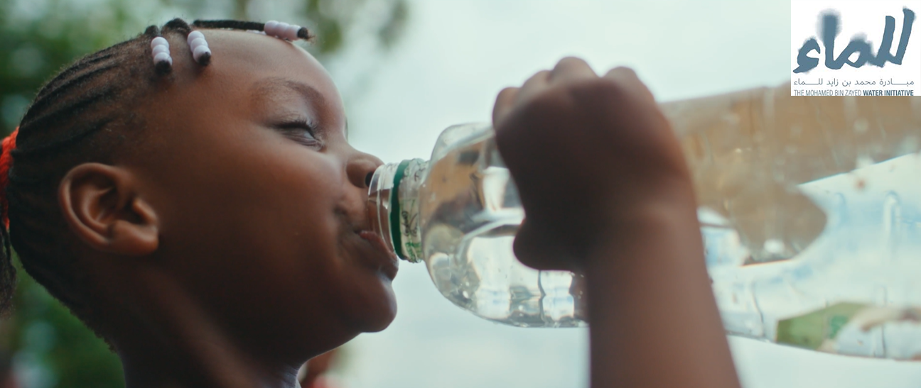 Community access to clean drinking water, highlighting the human impact of water security initiatives and the role of enablers in deploying solutions.