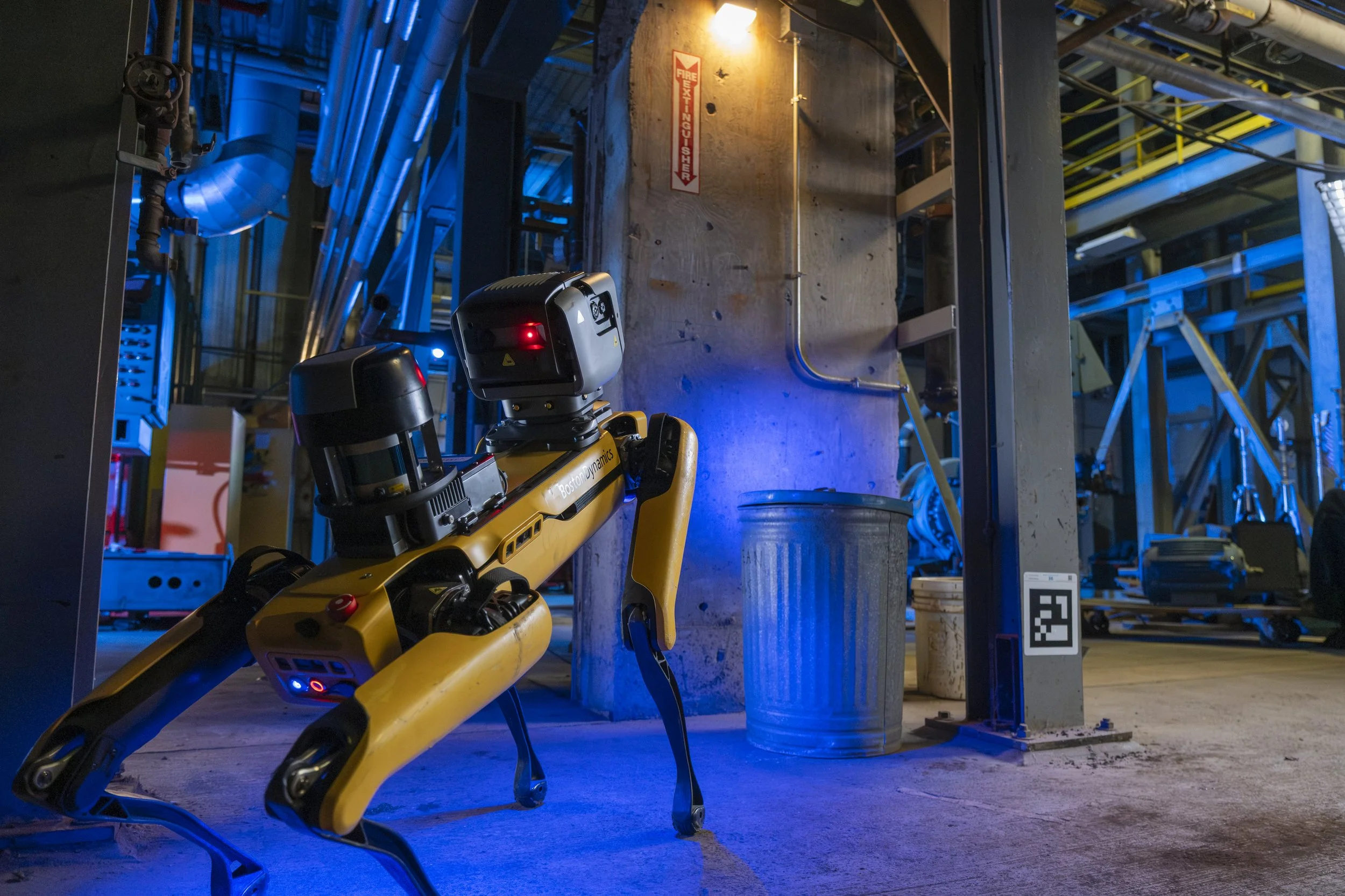 Boston Dynamics Spot robot operating inside an industrial facility during a robotics deployment.