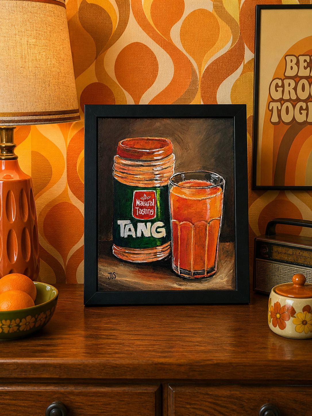 Tang drink mix jar with a glass of orange drink on a table