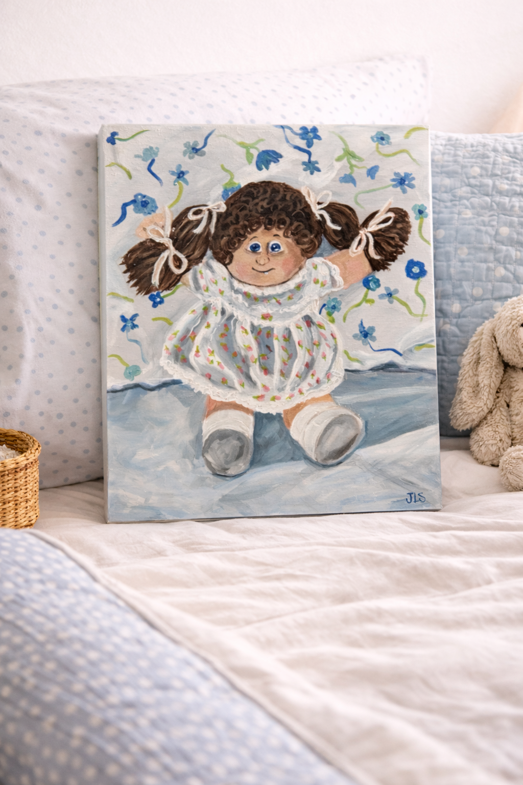 Cheerful painting of a retro Cabbage Patch doll in pale blue and white tones.