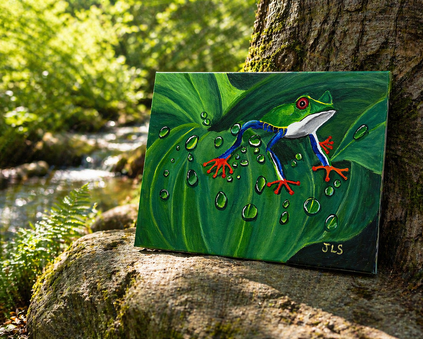 Green tree frog with red eyes and orange feet perched on a large leaf with visible water droplets (Copy)