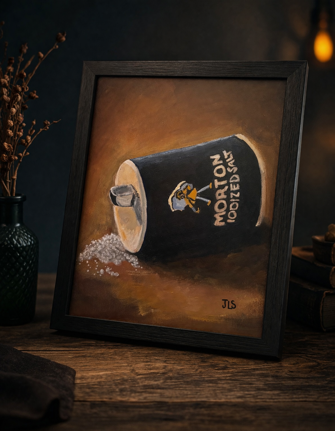 Morton salt container tipped on its side with salt spilled onto a tabletop