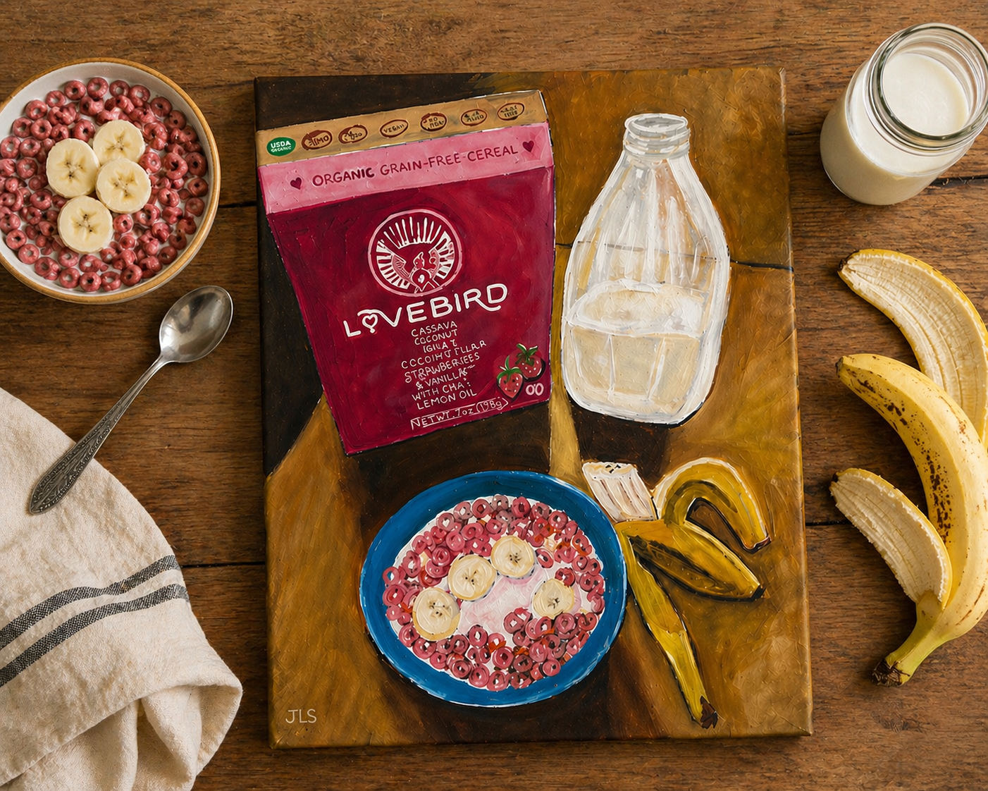 Bowl of cereal with banana slices and milk next to a cereal box and peeled banana