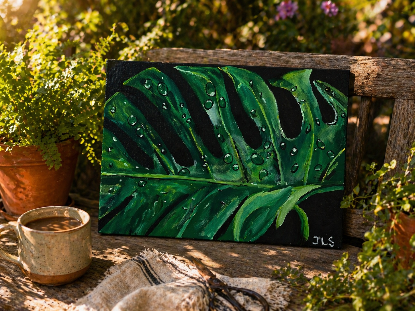 Large green leaf with glossy water droplets and deep shadows