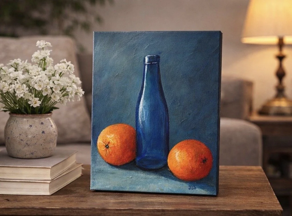 reflective glass blue bottle with oranges painting