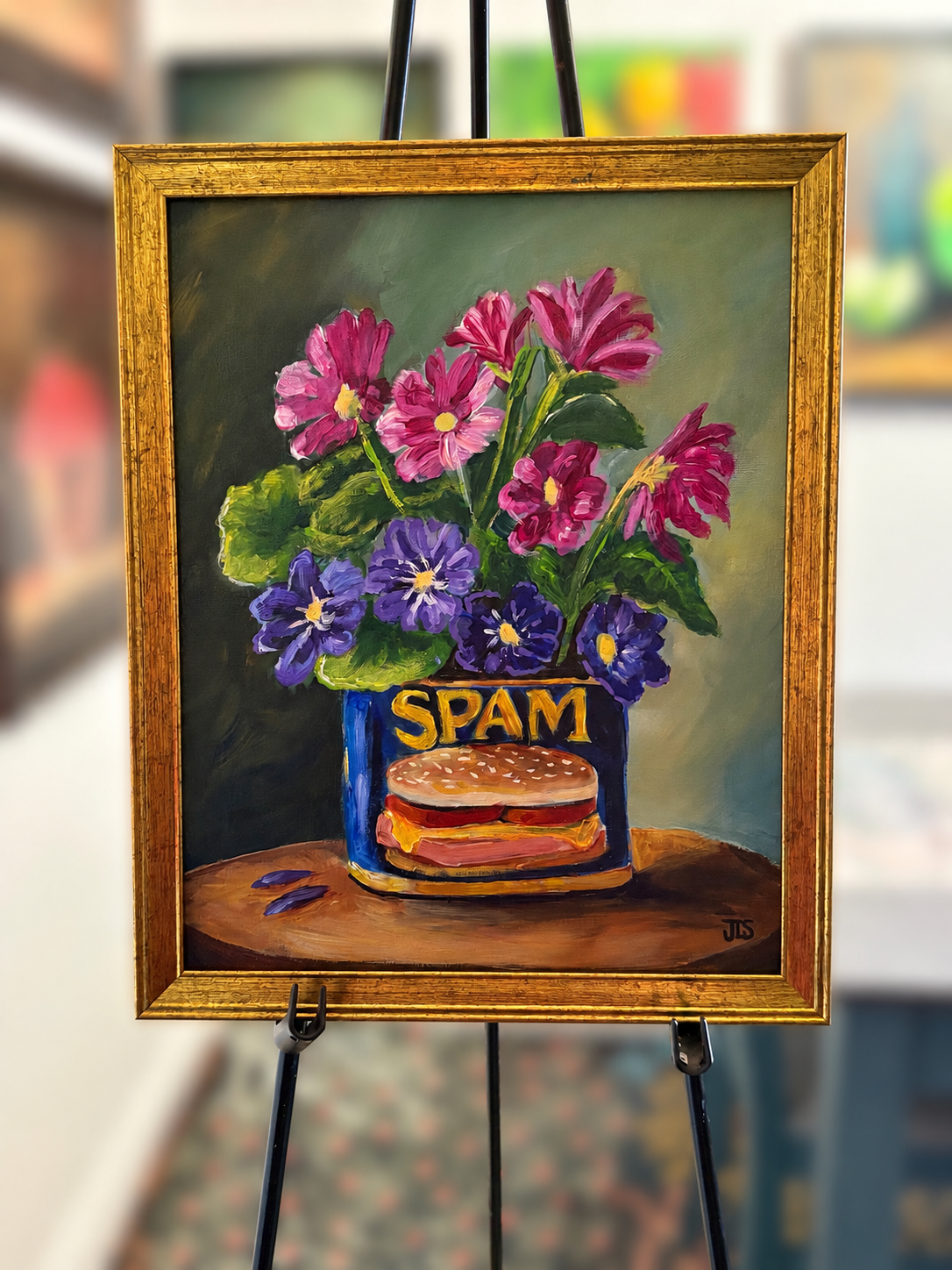 Original painting of pink and purple flowers arranged in a blue SPAM can