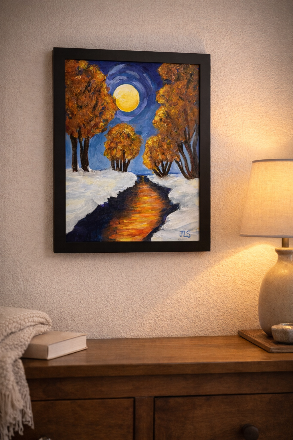Landscape painting of fall foliage at night with a full moon and snow lighting a path.