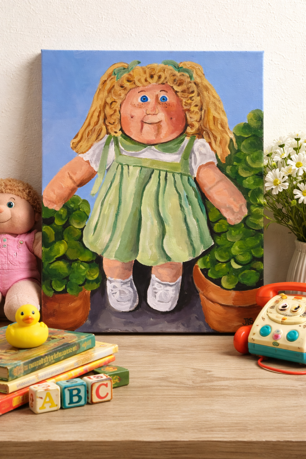 cabbage patch doll with brown yarn hair wearing green outfit standing beside potted plants on blue background