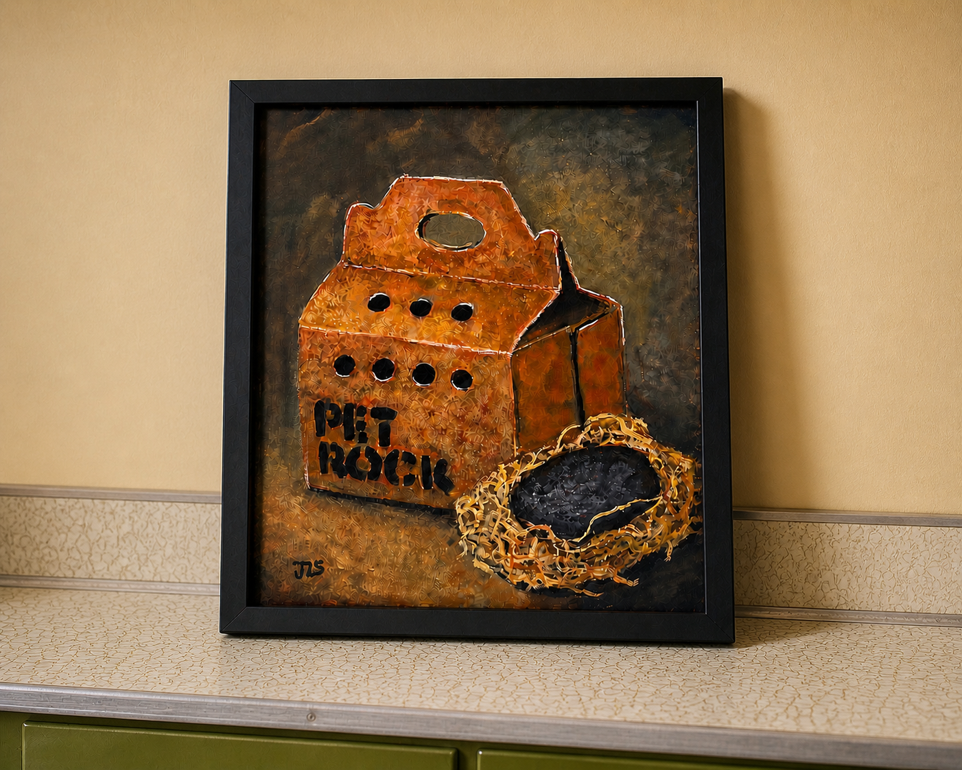Cardboard pet carrier box labeled “PET ROCK” with a gray rock