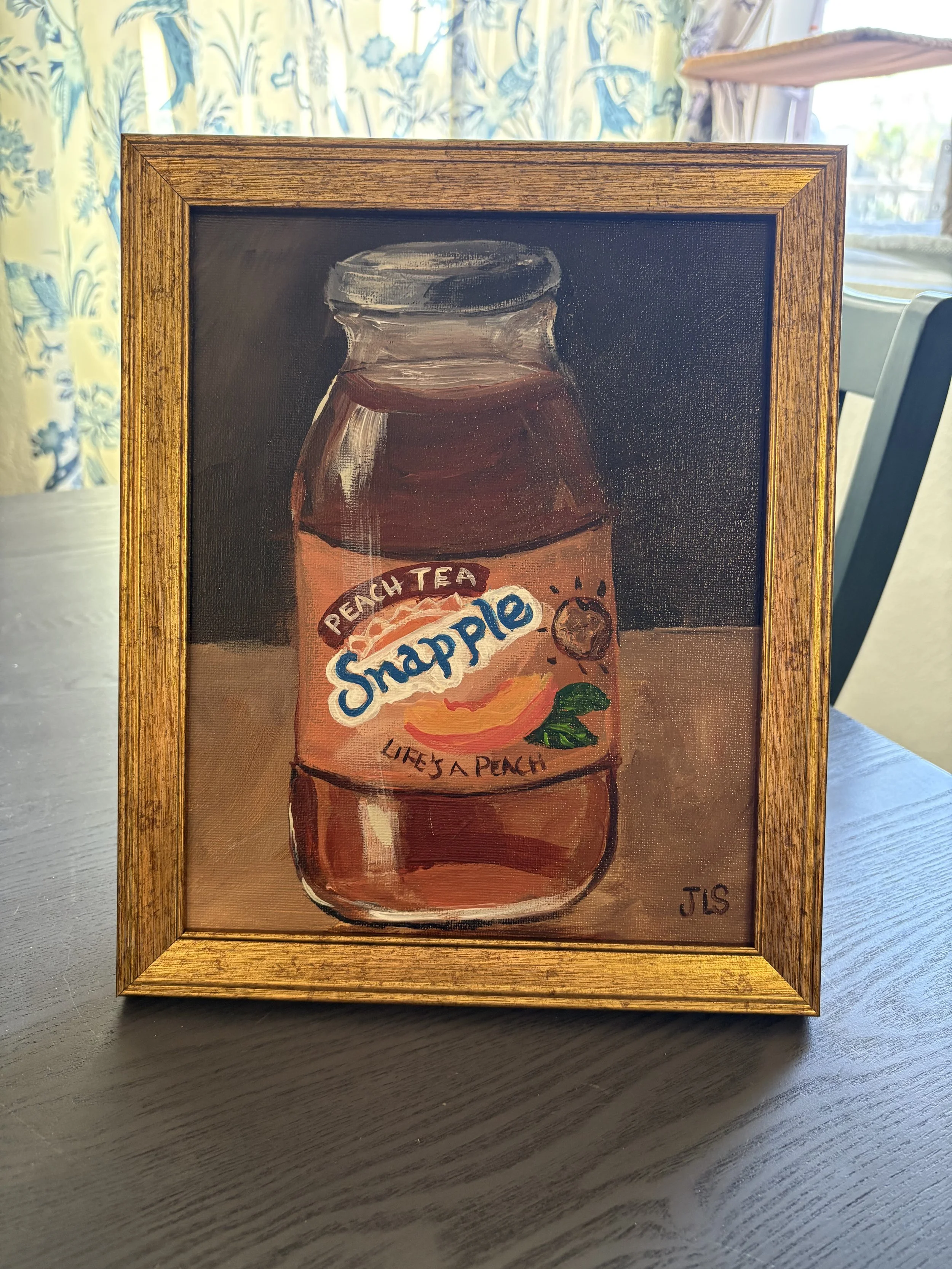 Glass bottle of retro snapple peach tea
