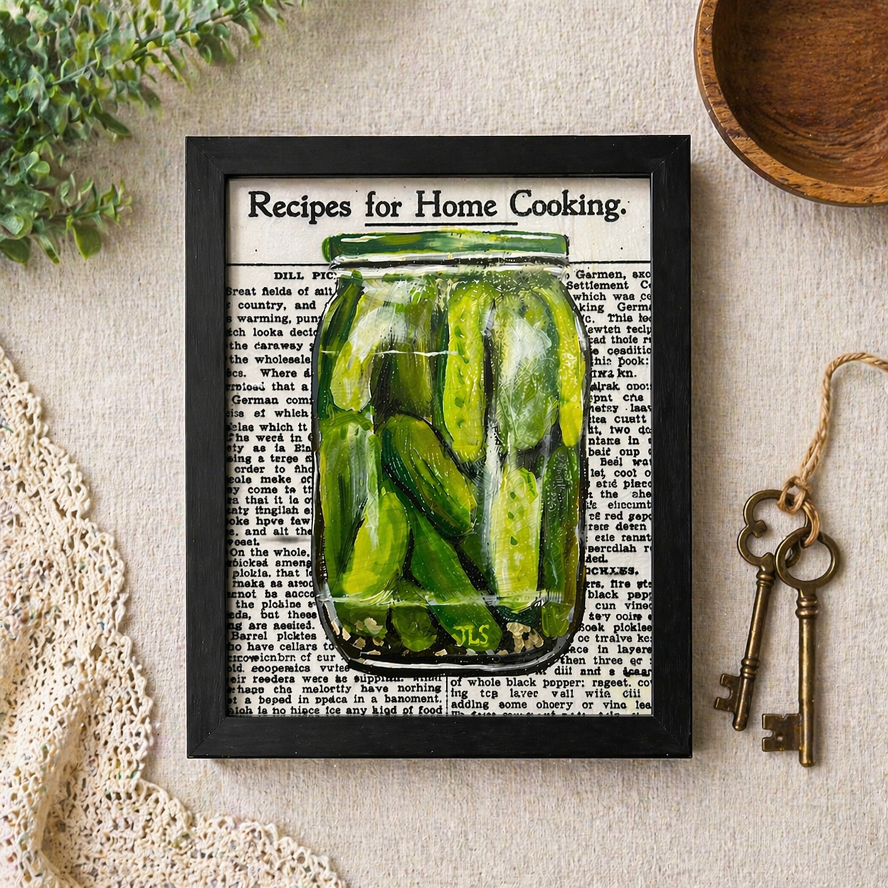 Glass jar filled with whole and sliced pickles with garlic on a vintage cookbook-style text background