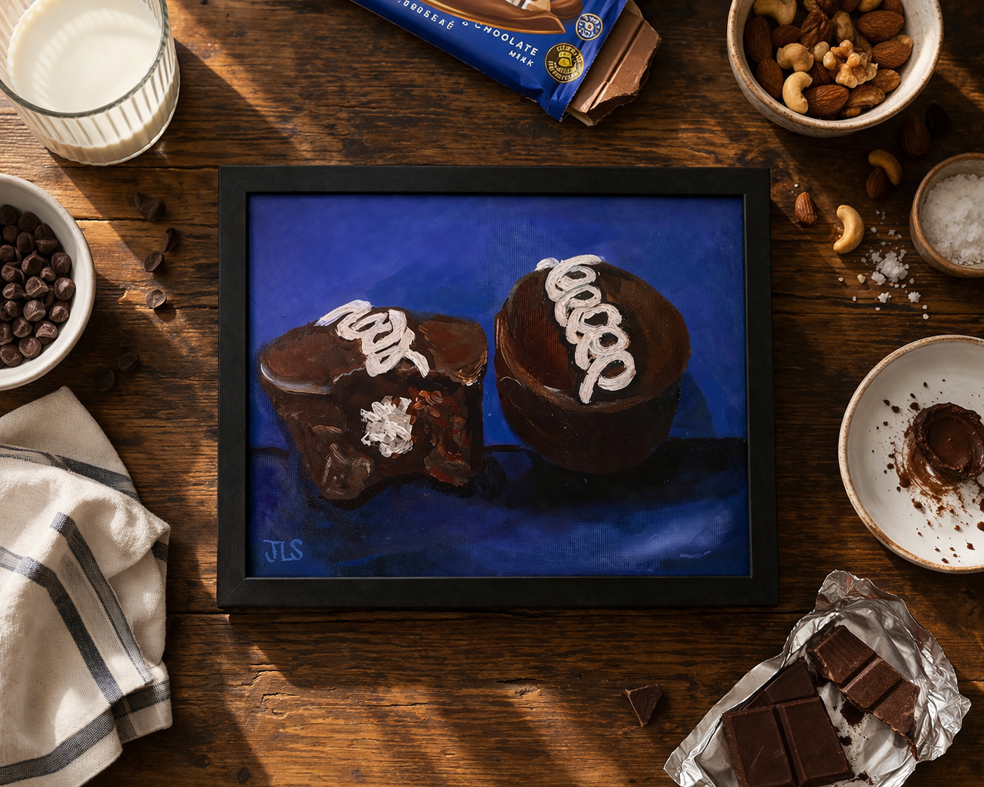 Packaged Hostess chocolate cupcakes in a clear plastic container with blue wrapper and white icing swirls on top