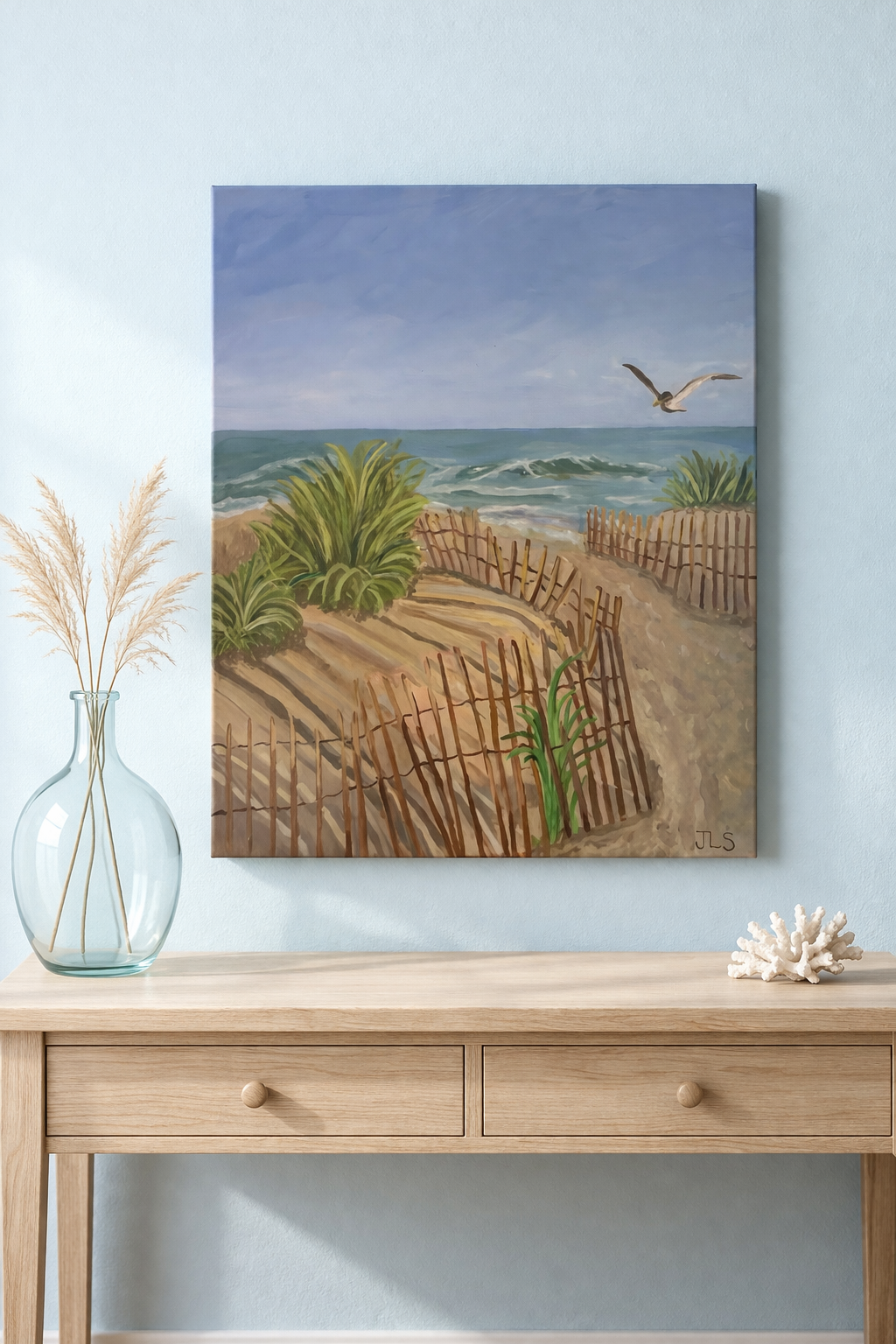 Coastal painting of an ocean shoreline with a sandy beach and a seagull, capturing soft waves, open sky, and a peaceful seaside atmosphere.
