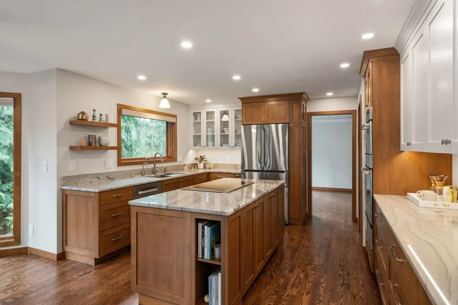 Award-winning whole home remodel by Massey Remodel + Design featuring a renovated kitchen with custom cabinetry and open layout in Tacoma, Washington