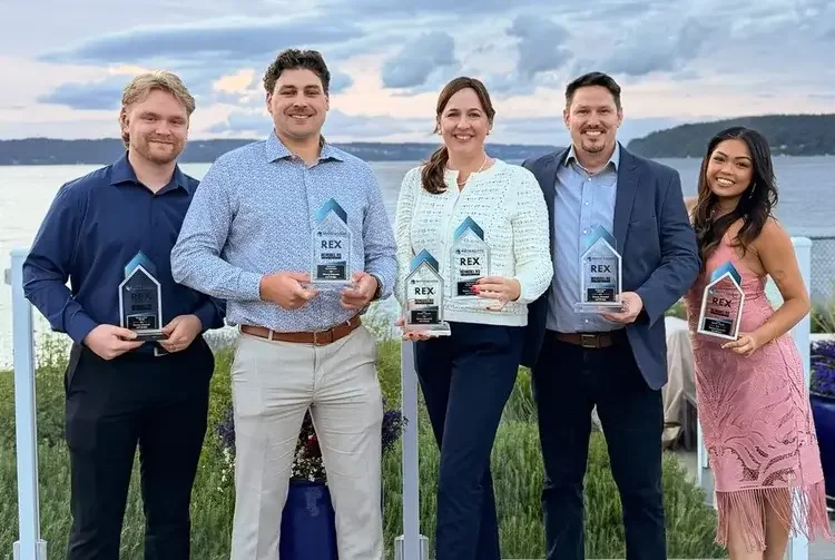 Massey Remodel + Design Team accepting 6 remodeling excellence awards at the Tacoma Yacht Club