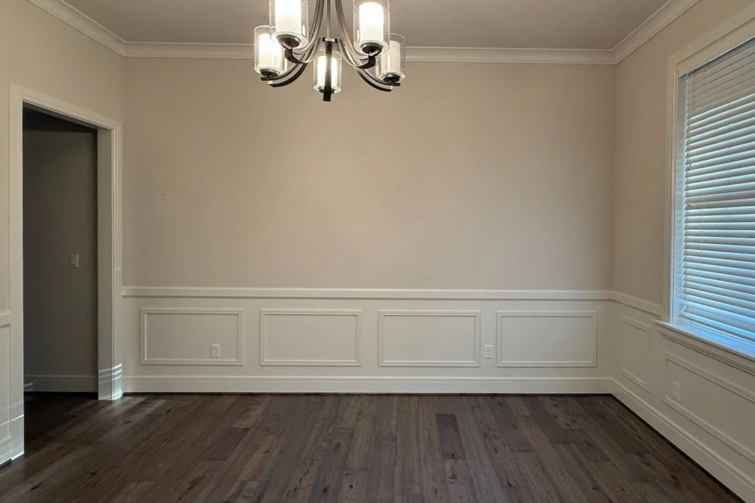 Before photo of the Sammamish office remodel showing the original empty wall and molding details prior to construction by the remodeling contractor.