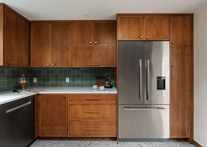 Sammamish WA kitchen remodel by a design-build contractor featuring custom wood cabinetry, green tile backsplash, quartz countertops, and stainless steel appliances