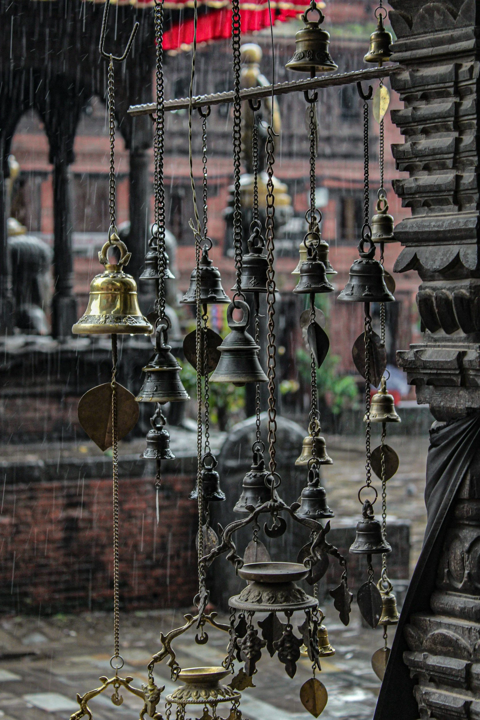 rain chains featuring bells in a town square