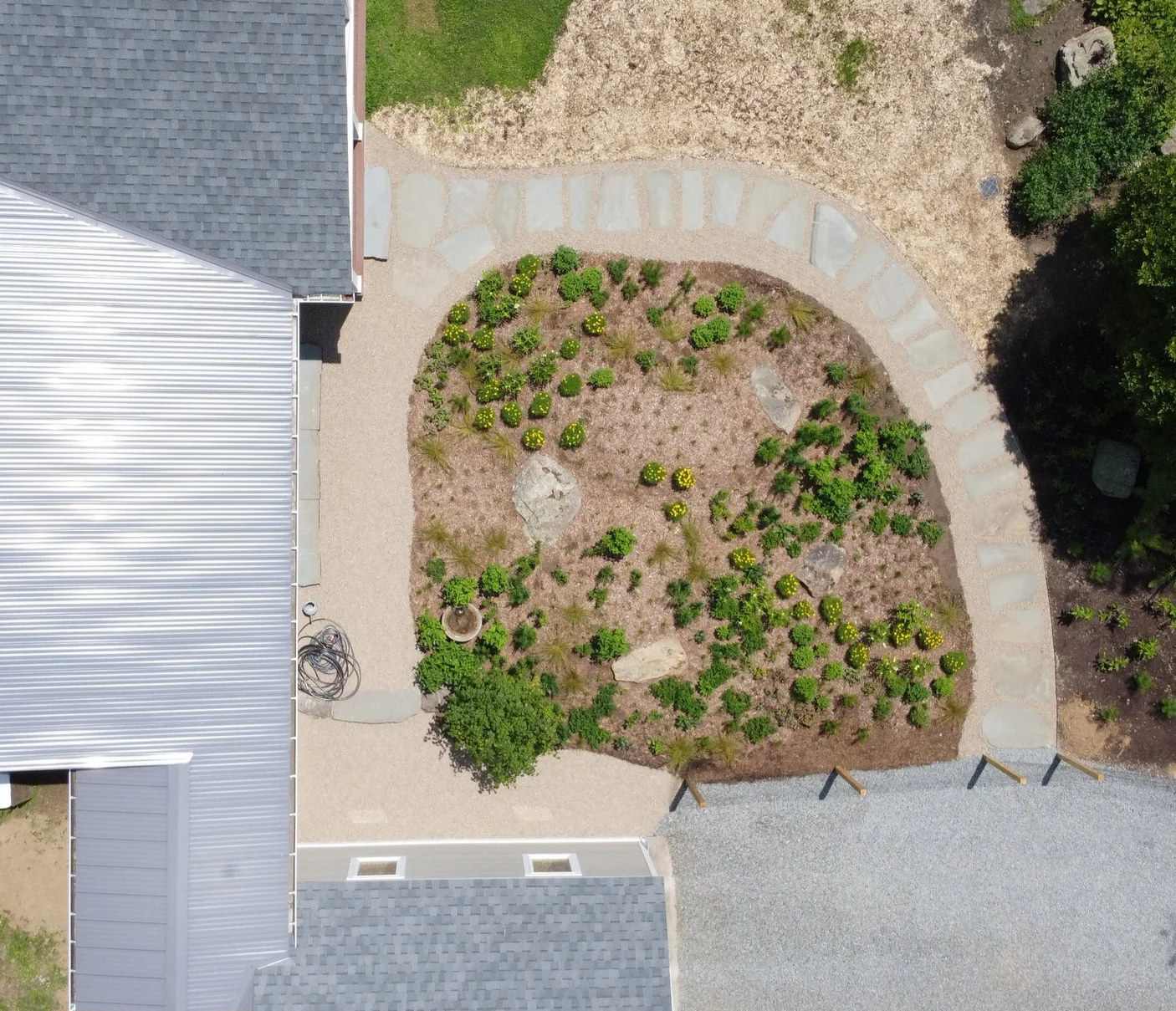Native+Knoll+perennial+garden+wrapped+in+local+stone+path_drone+above.png