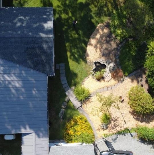 View+of+house+before+construction+featuring+entrance+from+garage.jpg
