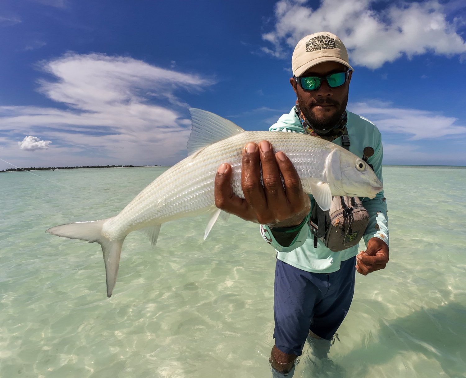 Christmas Island guide displaying a bonefish before release