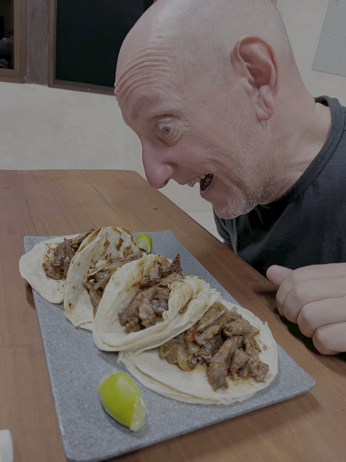 angler looks with delight at tacos at Xcalak Paradise lodge