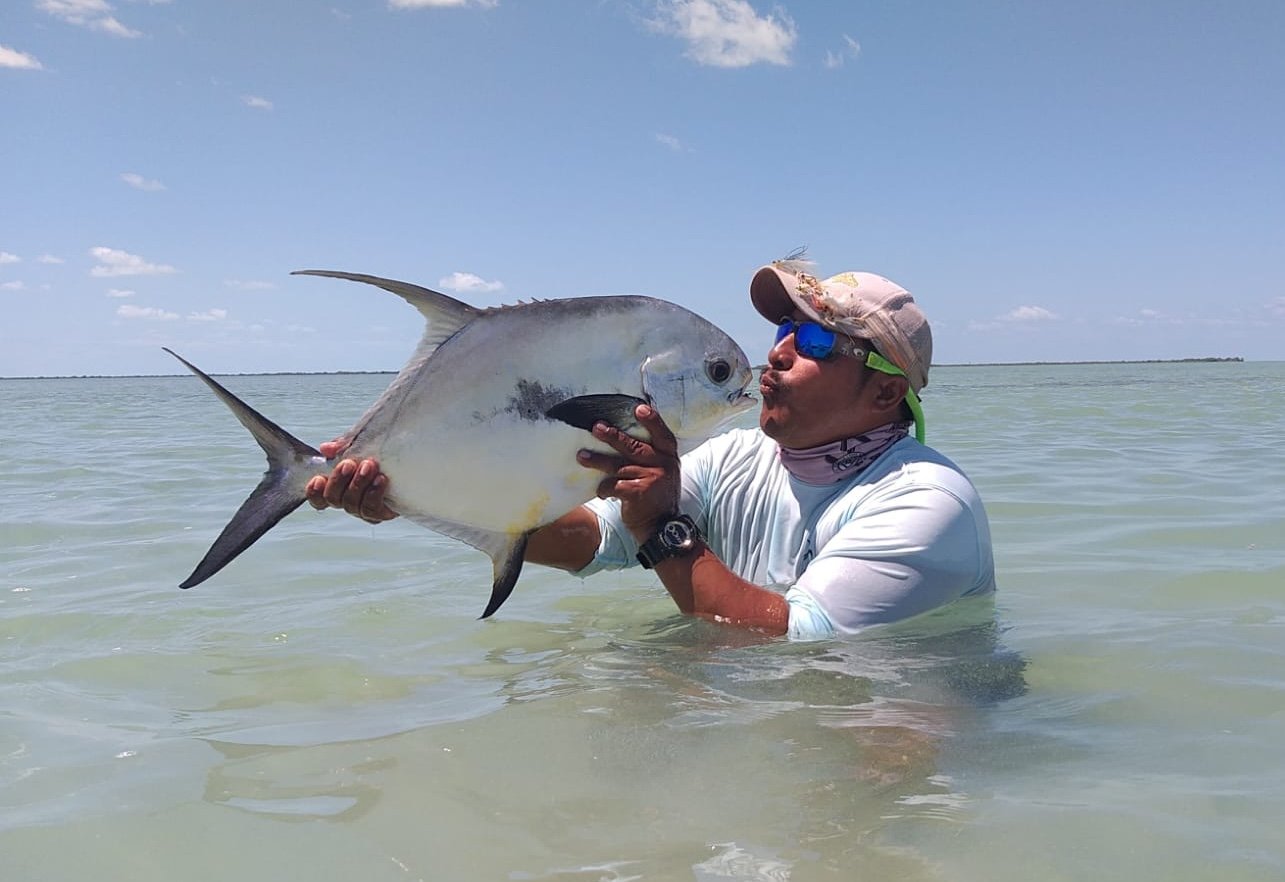 Angler at Xcalak with trophy Permit from Isolation Outfitters Mexico 