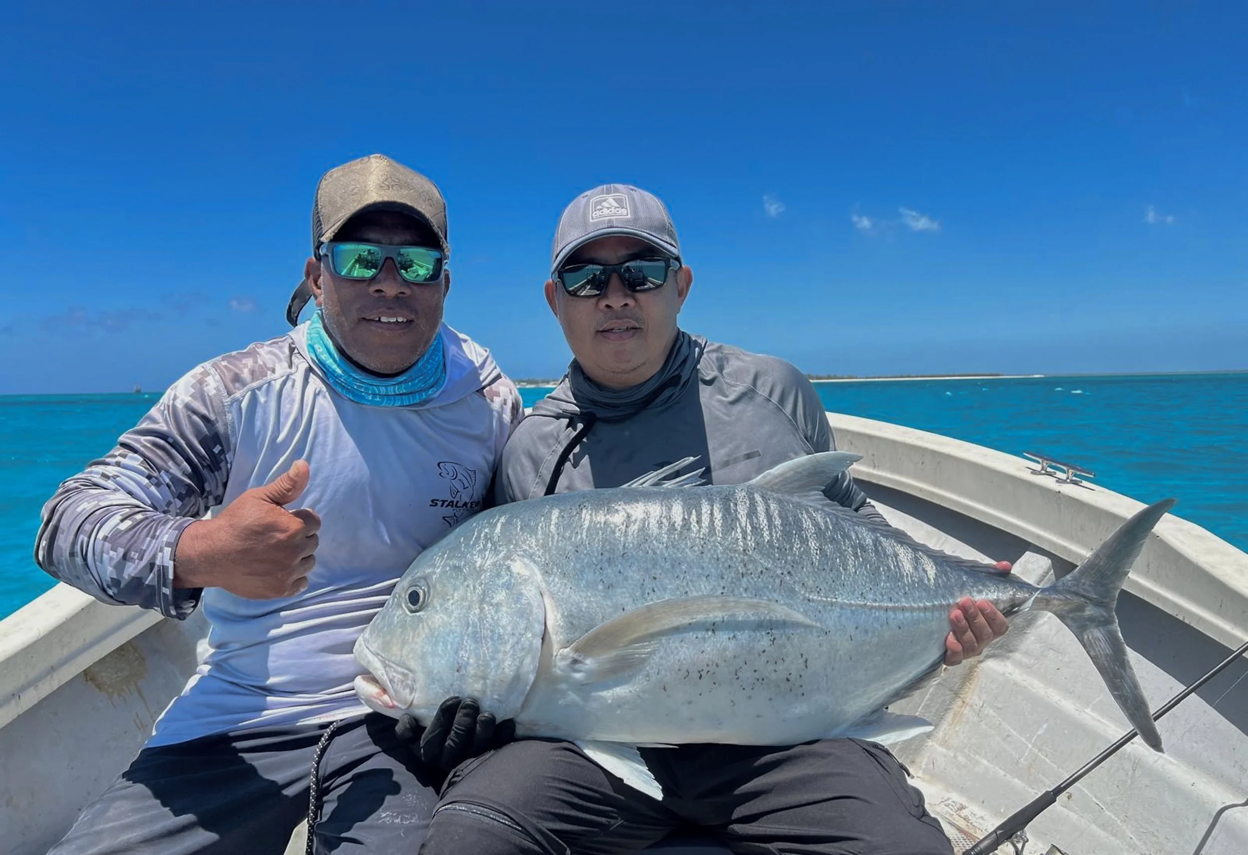 Guide and angler with Giant Trevally.jpg