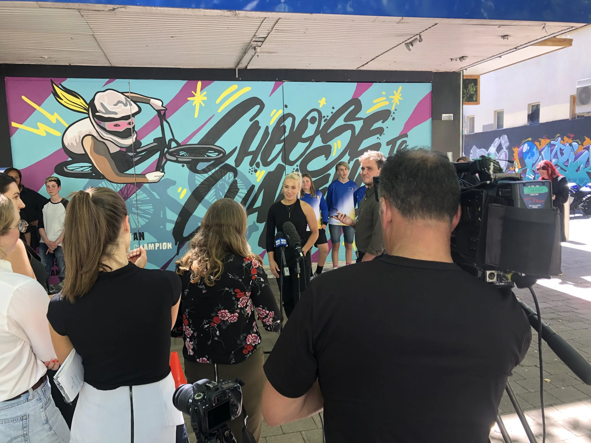 Mural workshop participants interviewed alongside Olympian by WIN news and ABC to celebrate their International Women's Day project