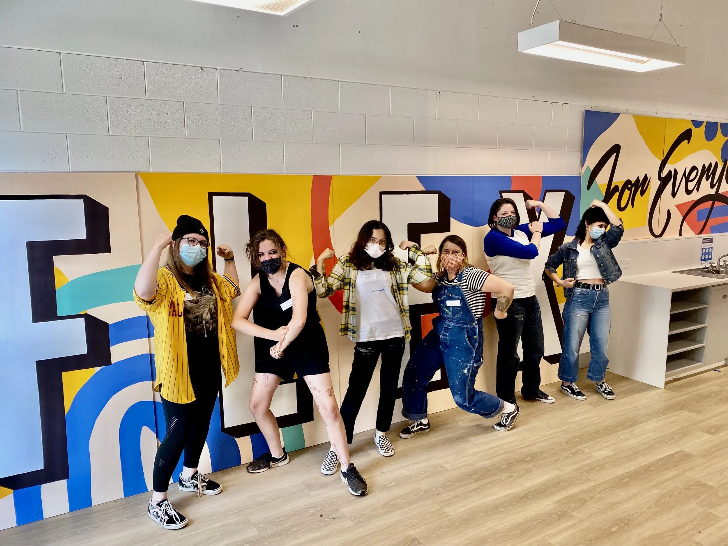 Participating students getting their flex on, infront of their new creation for their high school Flexible Learning Centre
