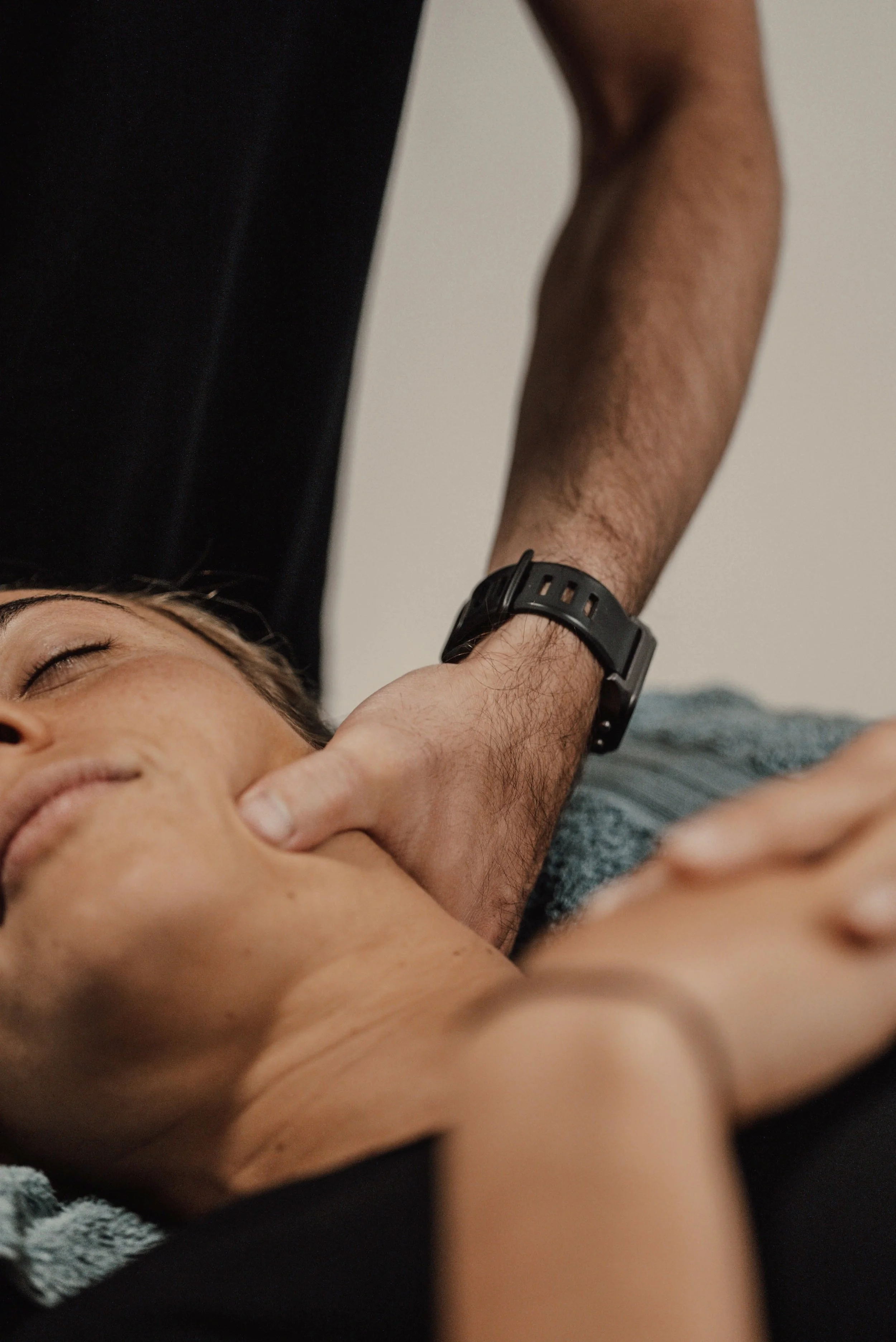 Osteopath applying gentle hands-on treatment to the jaw and neck during a headache consult in Tweed Heads, near Coolangatta