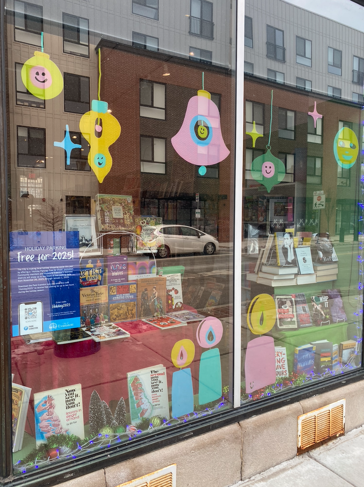 holiday window paintings at Squeezebox Books & Music