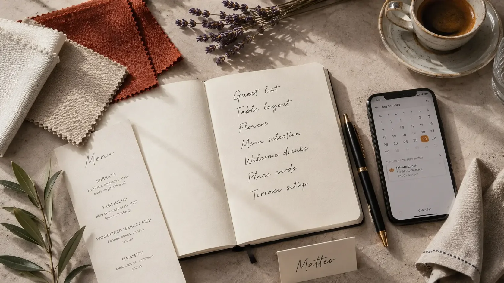 Bridal shower planning checklist notebook with calendar, fabric swatches and pen on a marble desk