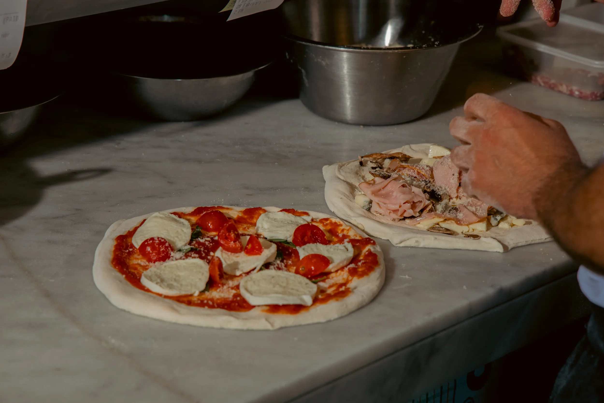 Shared Italian table with antipasti pizza pasta and wine in Sydney