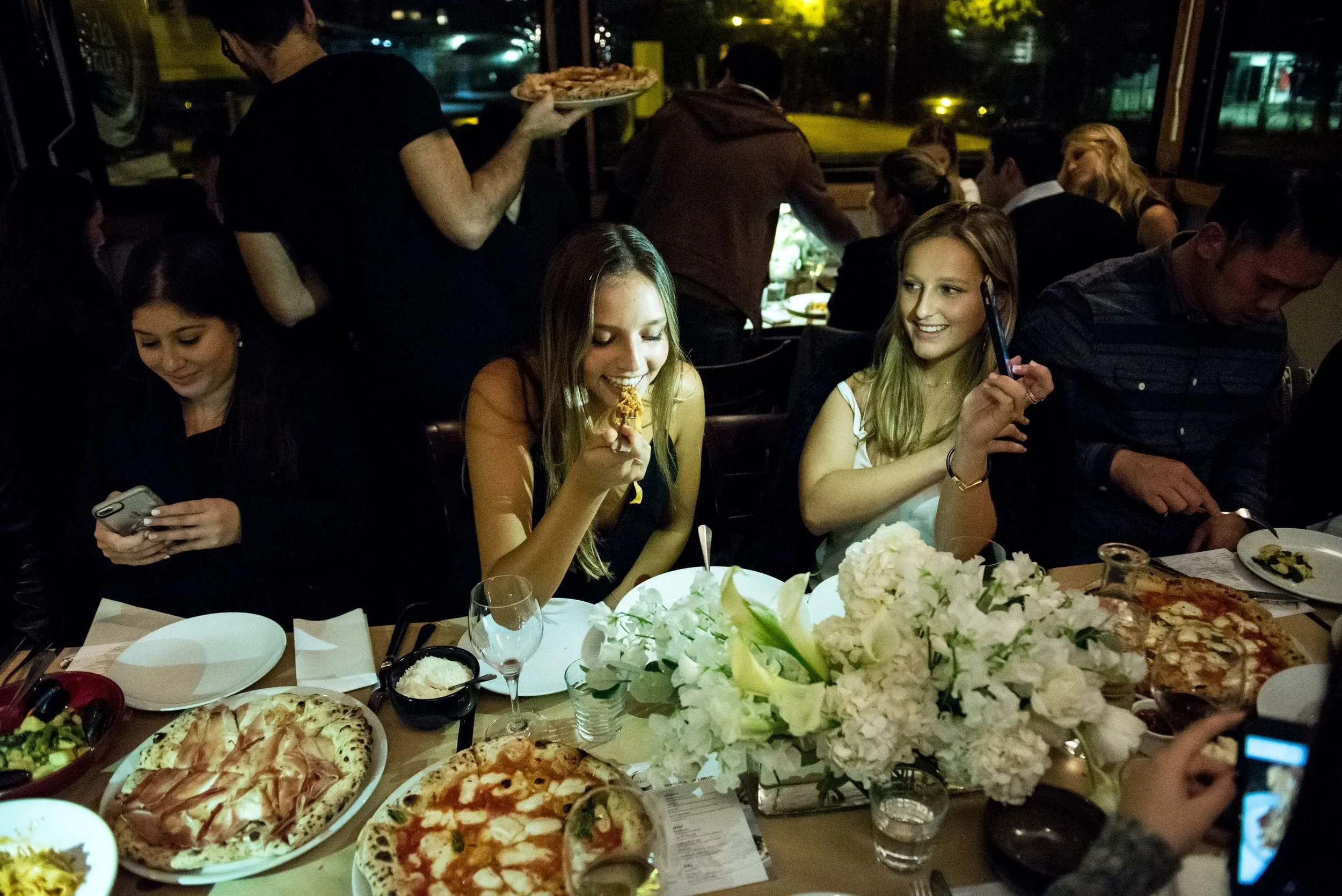 Group celebrating at Da Mario Rosebery – one of the best bucks party venues Sydney offers for Italian dining