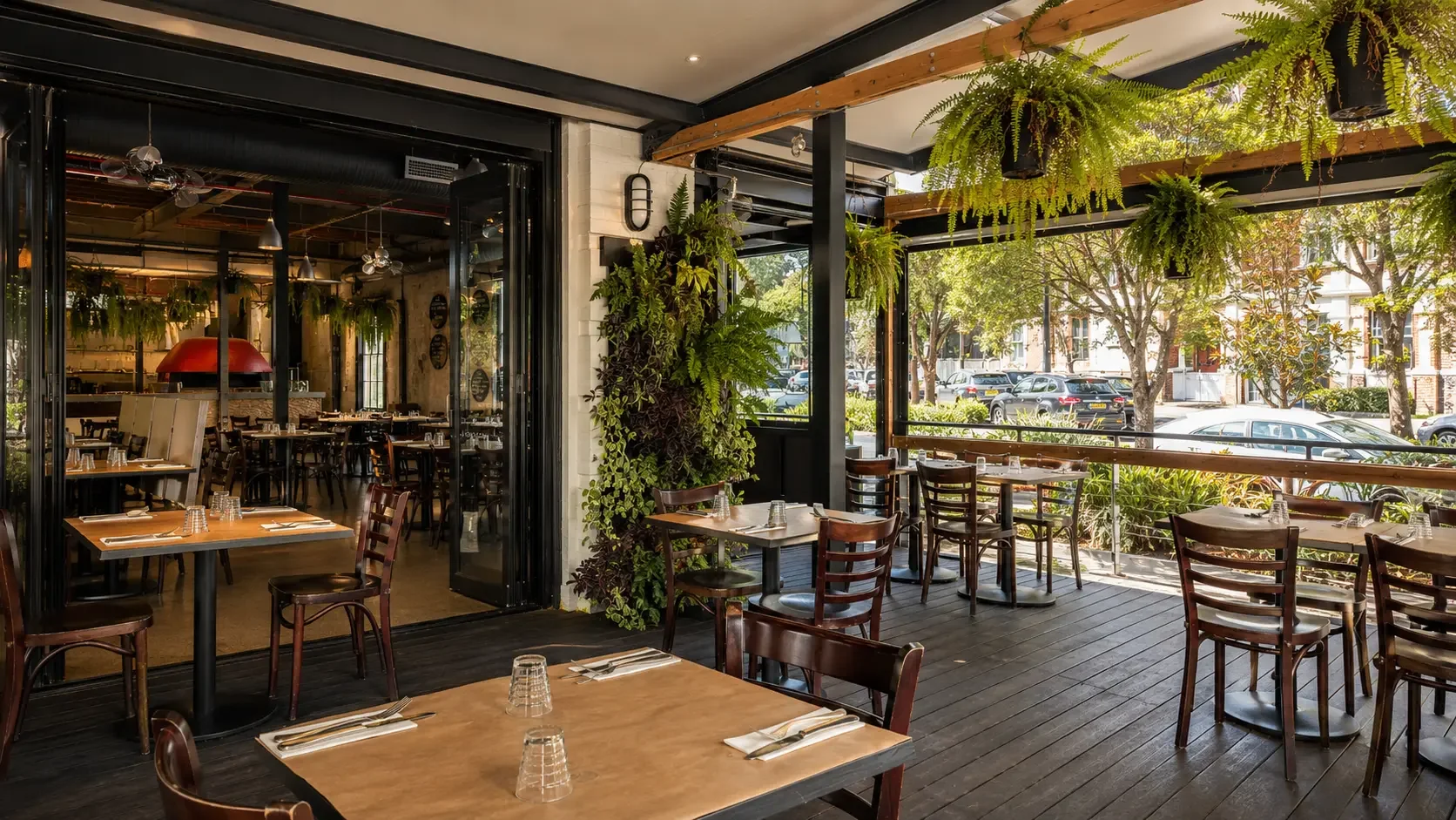 Sydney outdoor engagement party setup with festoon lights, greenery and timber finishes at Da Mario Rosebery