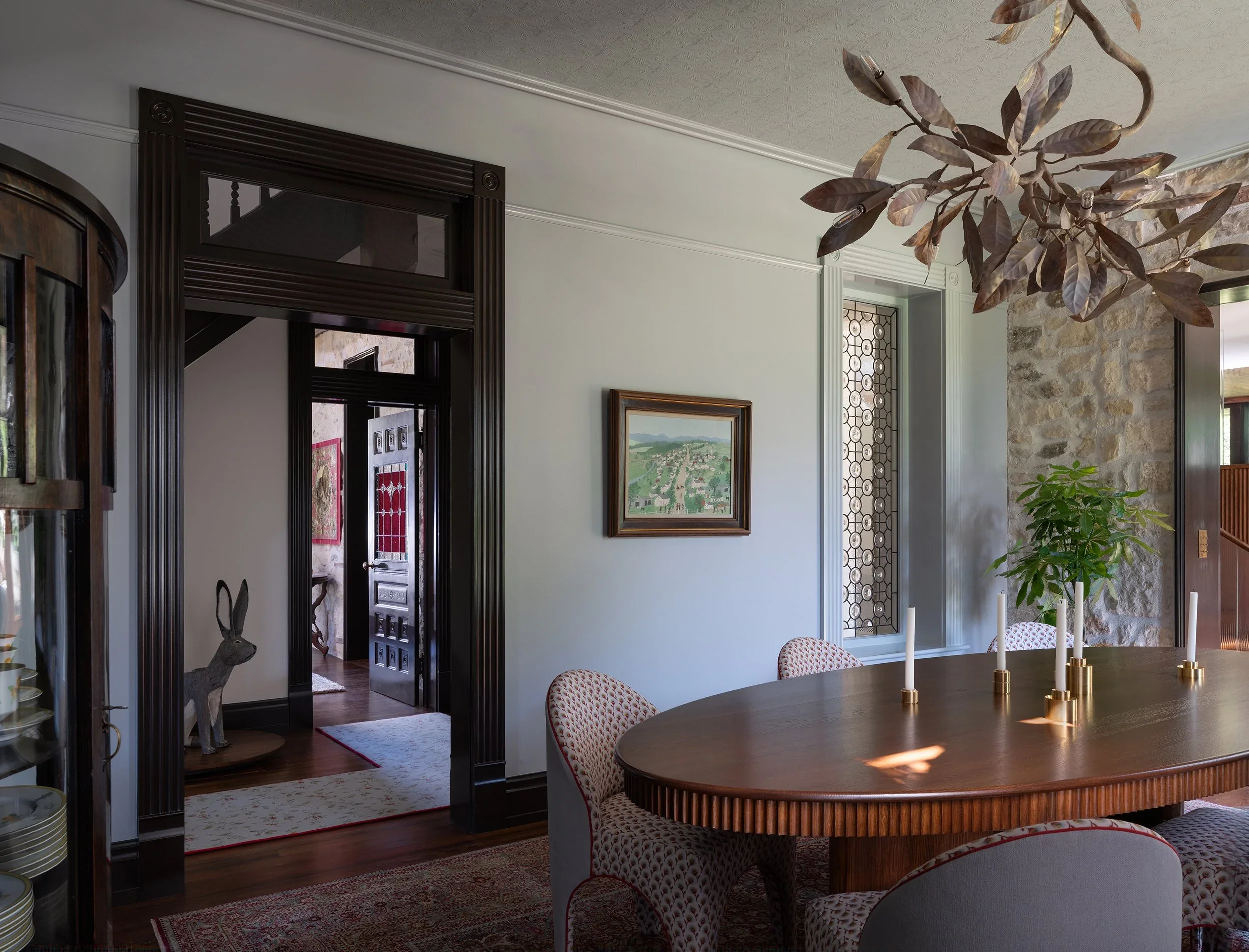 5_Past+and+Present+Place_Cuppett+Kilpatrick+Architecture+and+Interior+Design_Austin+Texas_historic-renovation-dining-room-interior-design-transom-leaded-glass.jpg.webp