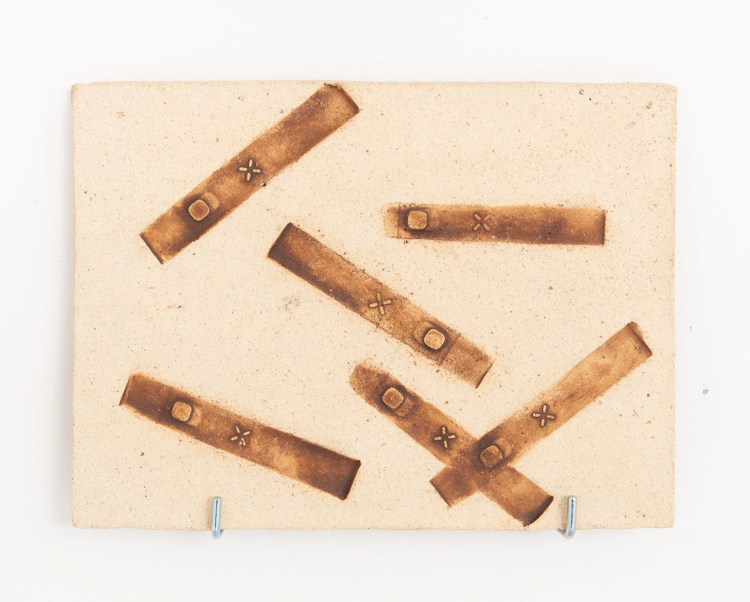 Jared Goldfischer,  Group of Vape Fossils , 2026. White stoneware and glaze, 6 1/2 x 9 in.