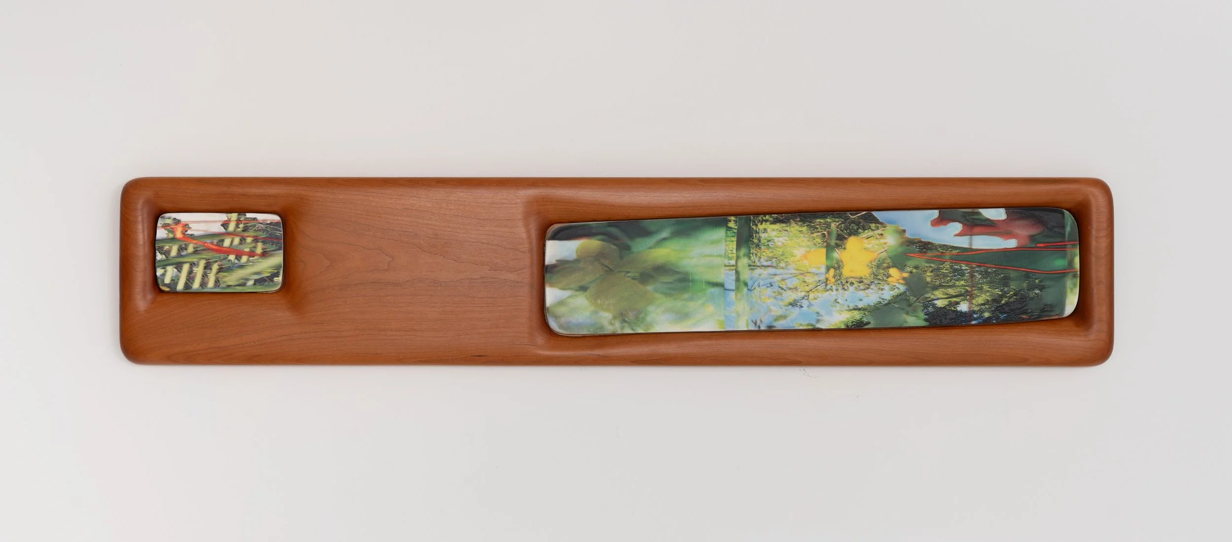 Neal Cashman,  Vendor , 2025. Cast Plaster, UV print, Cherry Frame, 7 x 41 x 1 1/4 in.