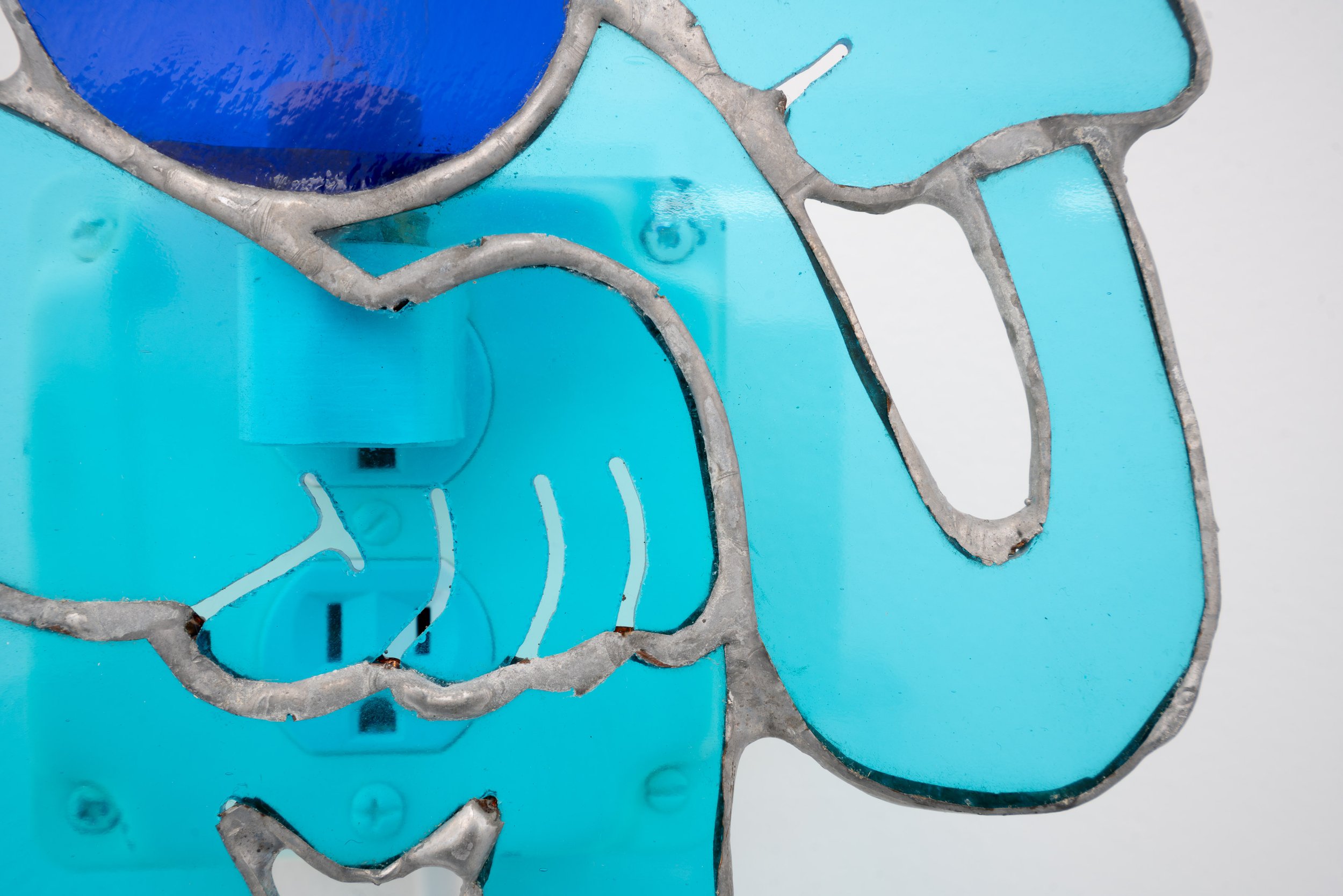 Jonny Campolo
Turn Off, 2021 (detail)
Stained glass, silver solder, nightlight
7 x 8 x 2 in