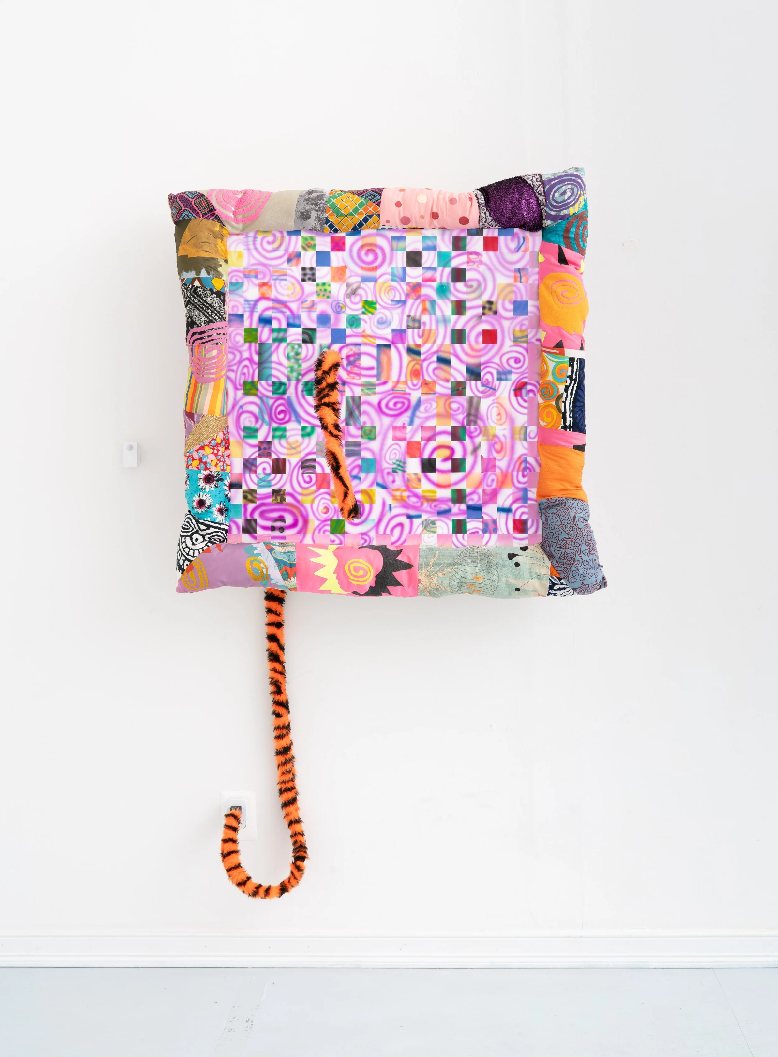 Simone Siegel,   I DIED LAUGHING , 2025. Acrylic on paper mounted on panel in upholstered textile frame, synthetic tiger tail, electronics, 40 x 40 x 10 in.
