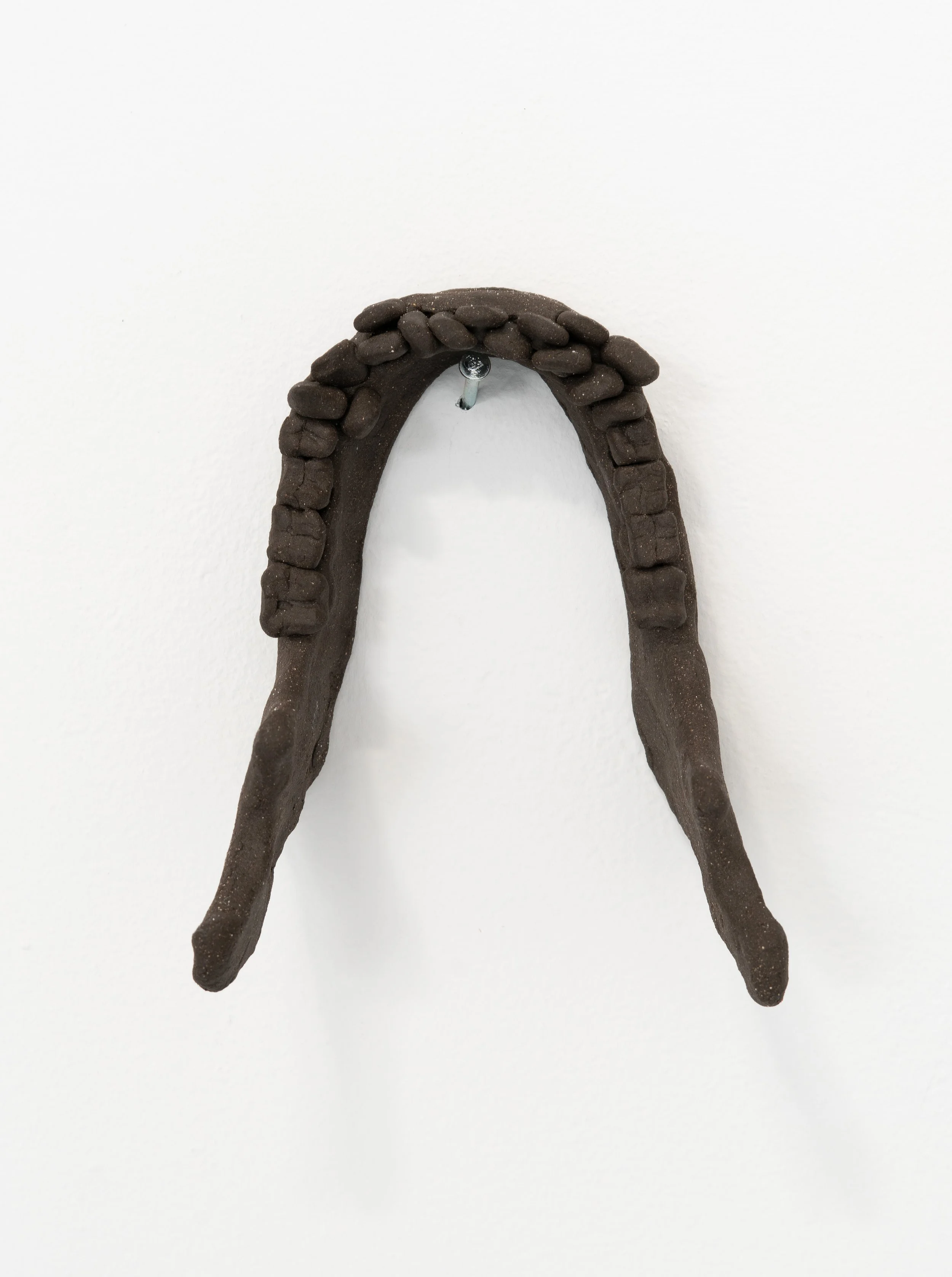 Jared Goldfischer,  Jaw of Og , 2026. Black stoneware, 7 x 7 x 4 in.