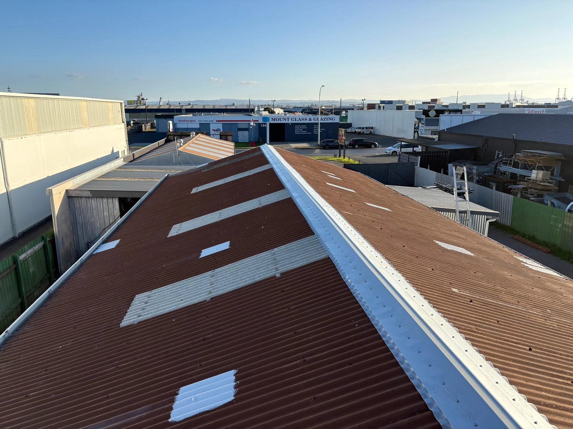 Top of commercial roof showing ridge replacement