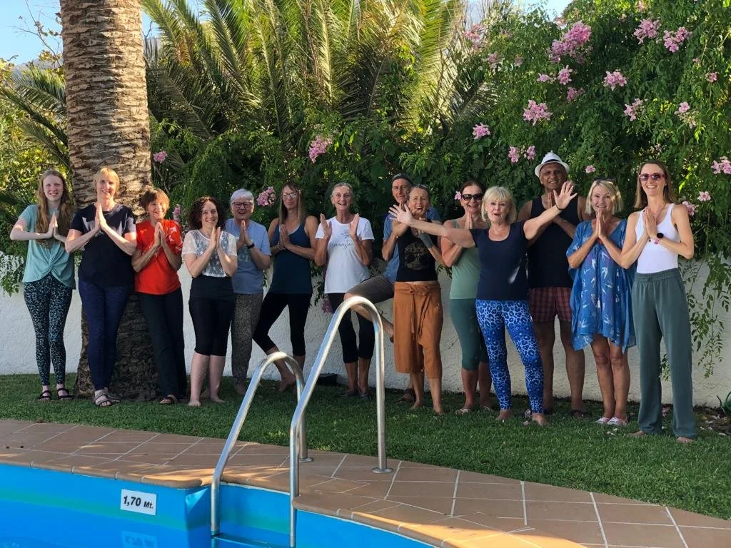 yoga-retreat-guests-waving-poolside.jpg