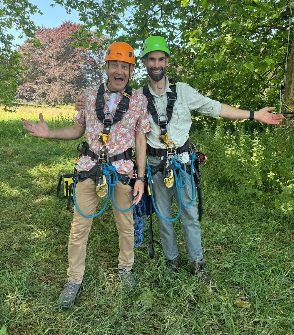 Tree climbers kitted up with safety equipment