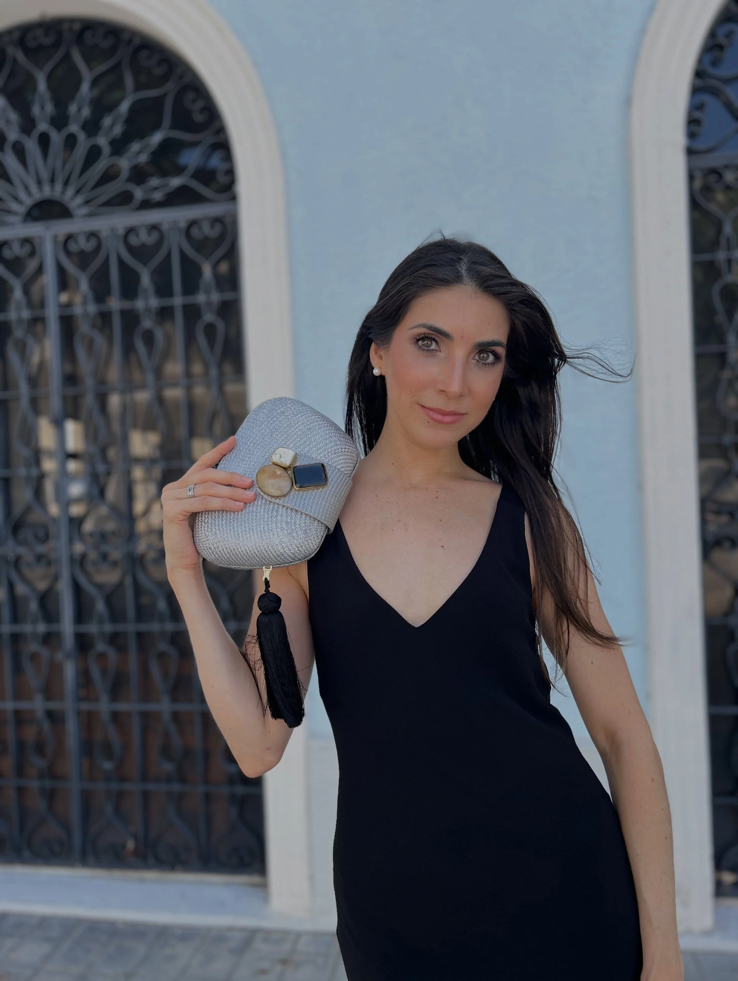 #canitellyou what to pack for a destination wedding in Puerto Rico? We&rsquo;ve got you covered. ✈️ 
The RAFE New York TAMU clutch in silver handwoven buntal, embellished with semi-precious stones, a flirty tassel and drop-in chain strap, brings just
