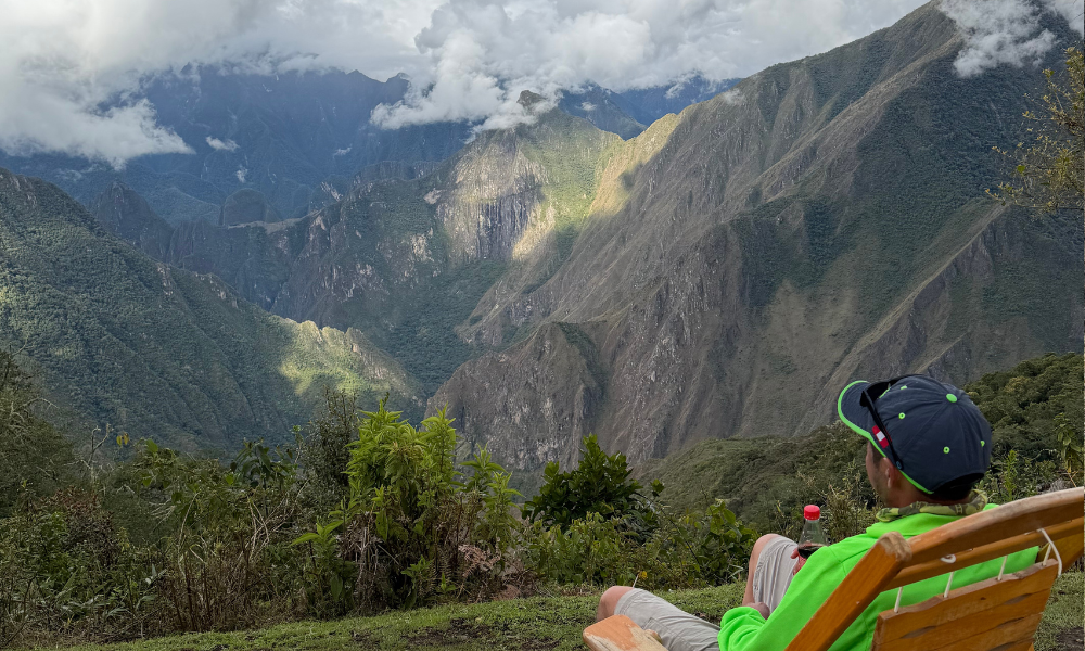 Man relaxing in front of a beautiful view in Peru