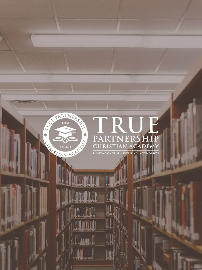 Photo of bookshelves in a library with a logo and text overlay for True Partnership Christian Academy.